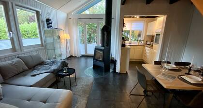 Vacation home with barrel sauna, fireplace and massage chair.