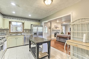 Fridge, stovetop, dishwasher, coffee/tea maker