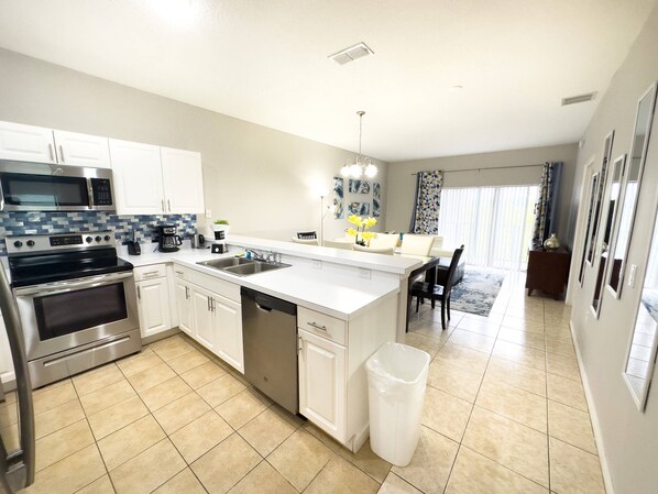 Microwave, dishwasher, high chair, paper towels