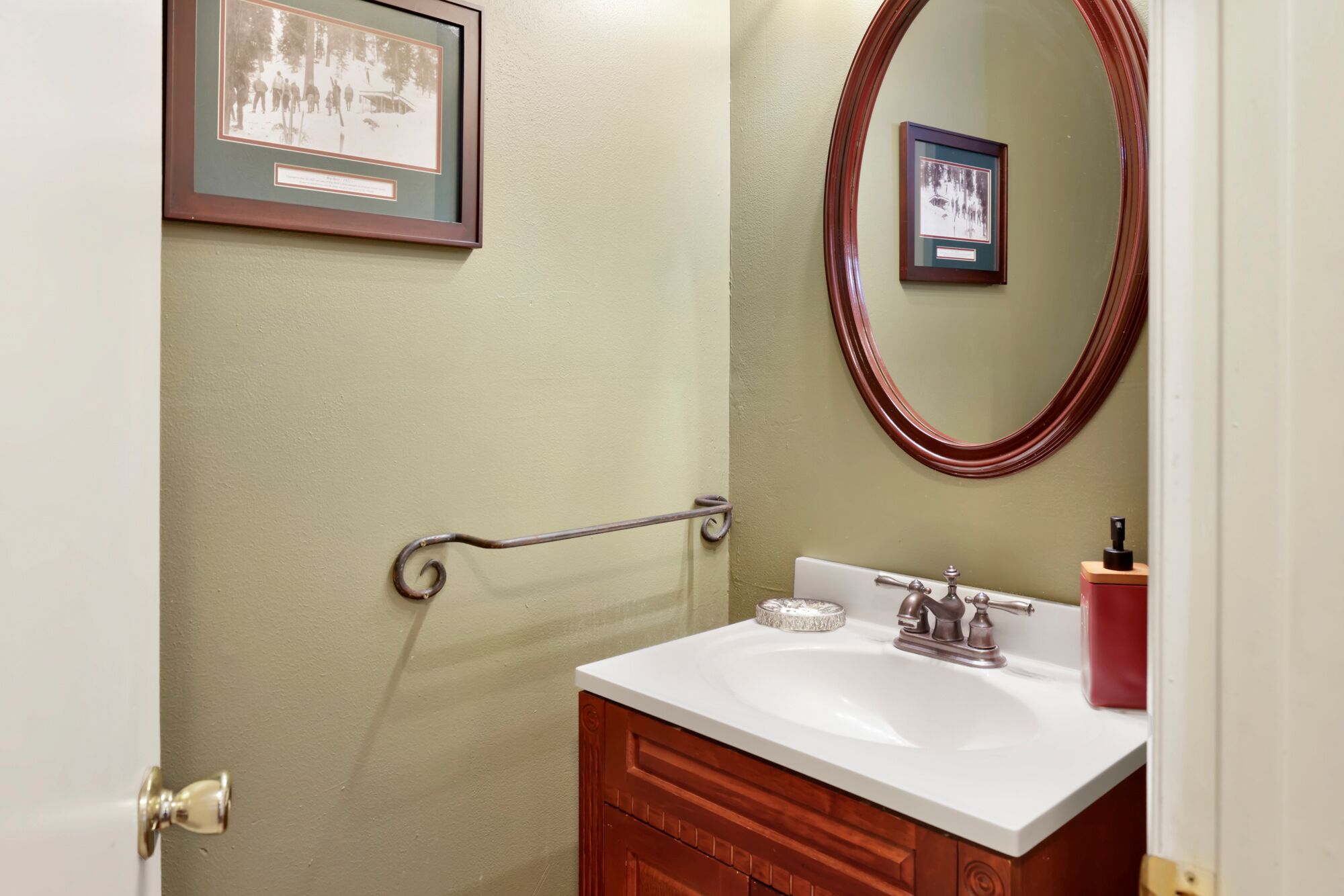 Clean and cozy cabin bathroom with a shower, sink, and toilet—simple, fresh, and comfortable for your everyday needs during a relaxing mountain stay.