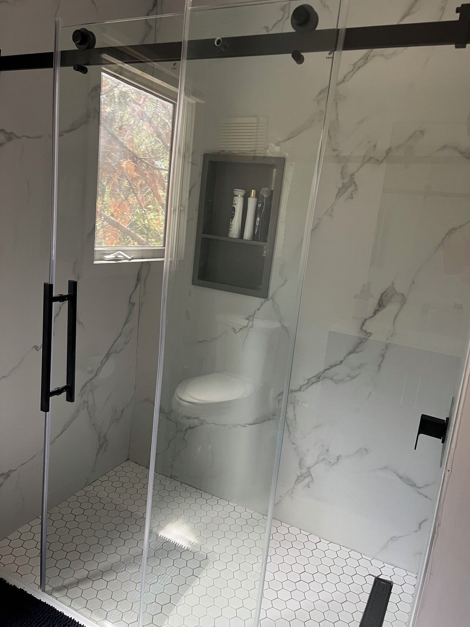 Combined shower/tub, hair dryer, towels, soap
