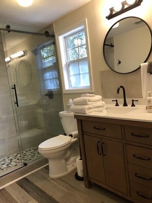 Combined shower/tub, hair dryer, towels, soap