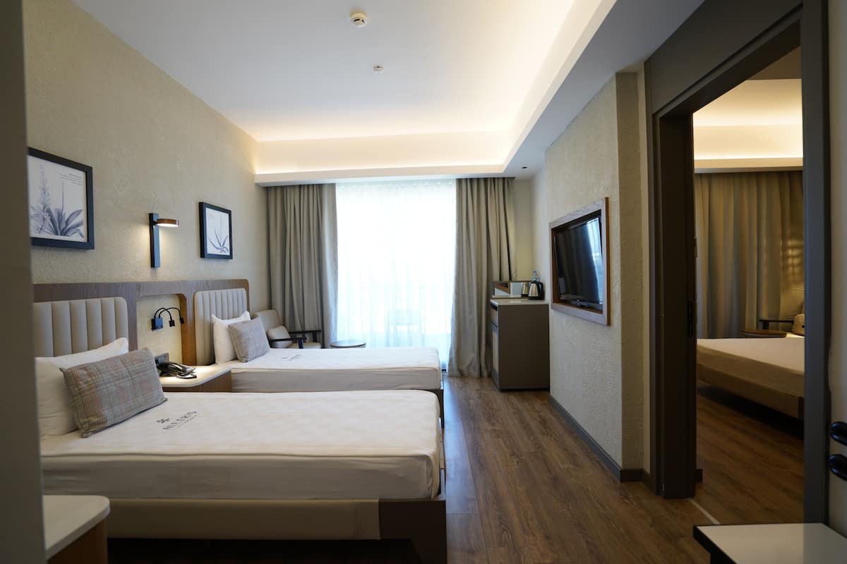 Familiekamer, uitzicht op tuin | Beddengoed