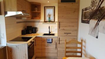 Fridge, microwave, stovetop, coffee/tea maker