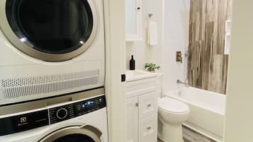 Combined shower/bathtub, hair dryer, towels, soap