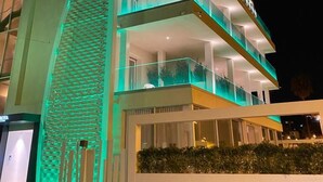 A modern hotel with a unique architectural design, featuring a prominent triangular structure and multiple balconies. - Europa Hotel (Marina di Vasto)