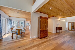 Enjoy meals with family and friends at the dining table for four, surrounded by natural light and comfortable seating.
