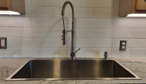 Combined shower/bathtub, hair dryer, towels, soap