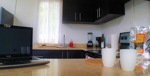 Fridge, microwave, oven, stovetop - Modern 2br/1.5ba Apt w/ AC, View & Location. #D (Santa Ana, Pozos)