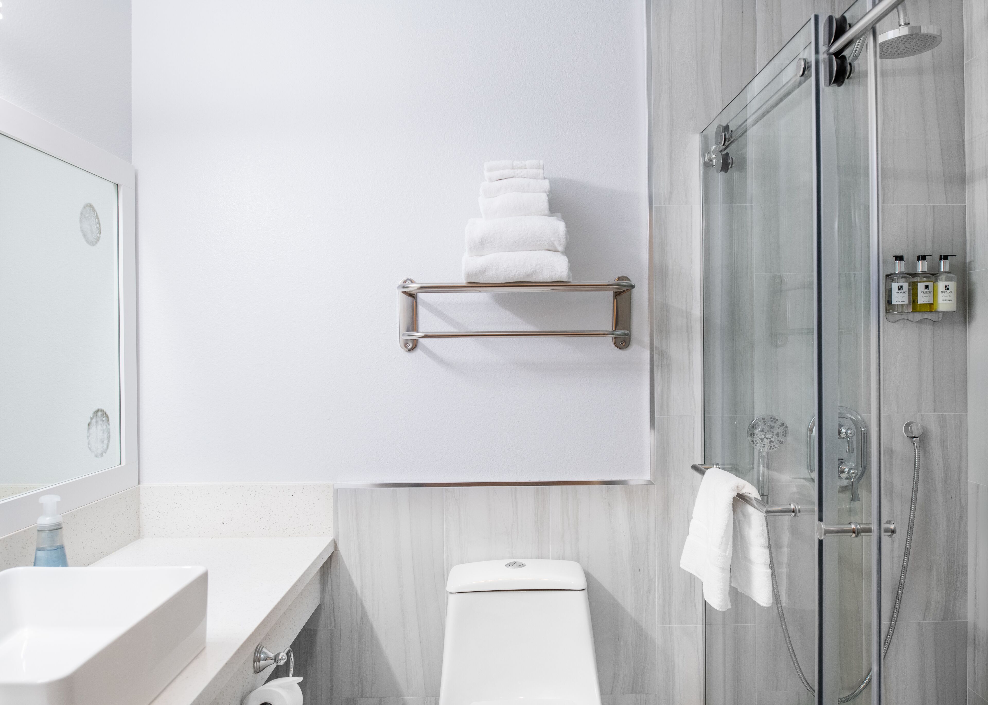 separate bathtub and shower, towels, soap, shampoo