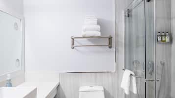 Separate tub and shower, towels, soap, shampoo