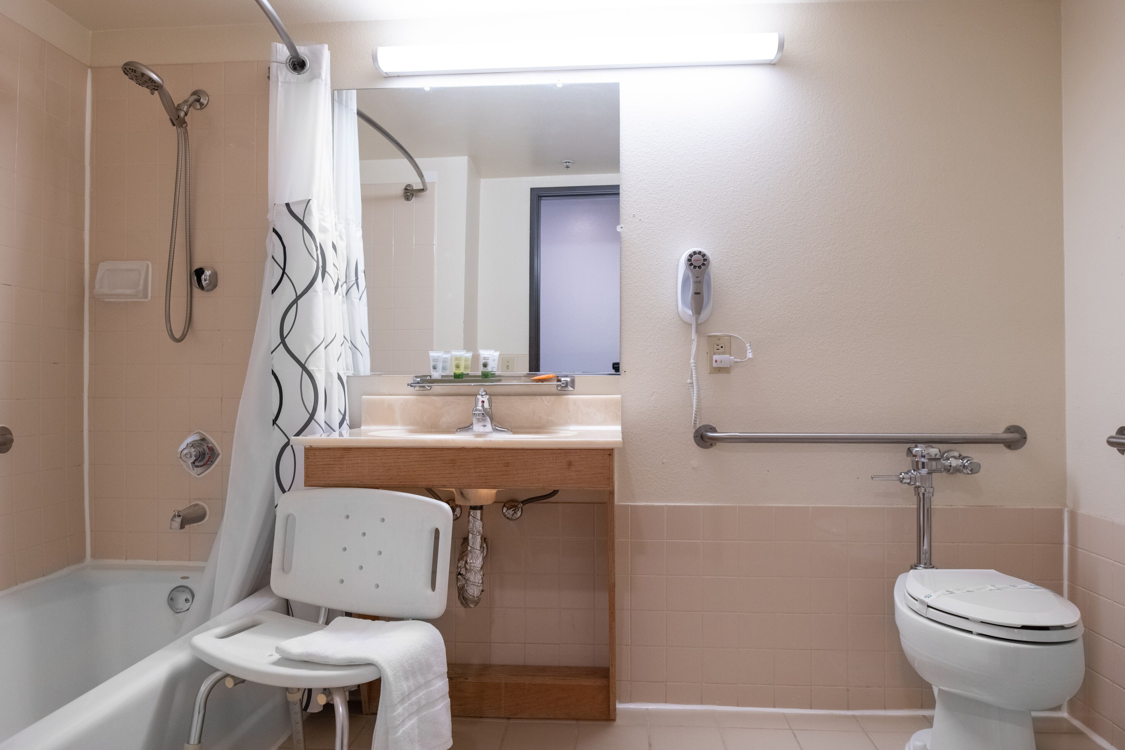 standard room | bathroom | separate bathtub and shower, towels, soap, shampoo