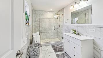Combined shower/tub, hair dryer, towels, soap