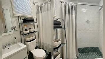 Combined shower/tub, hair dryer, towels, soap