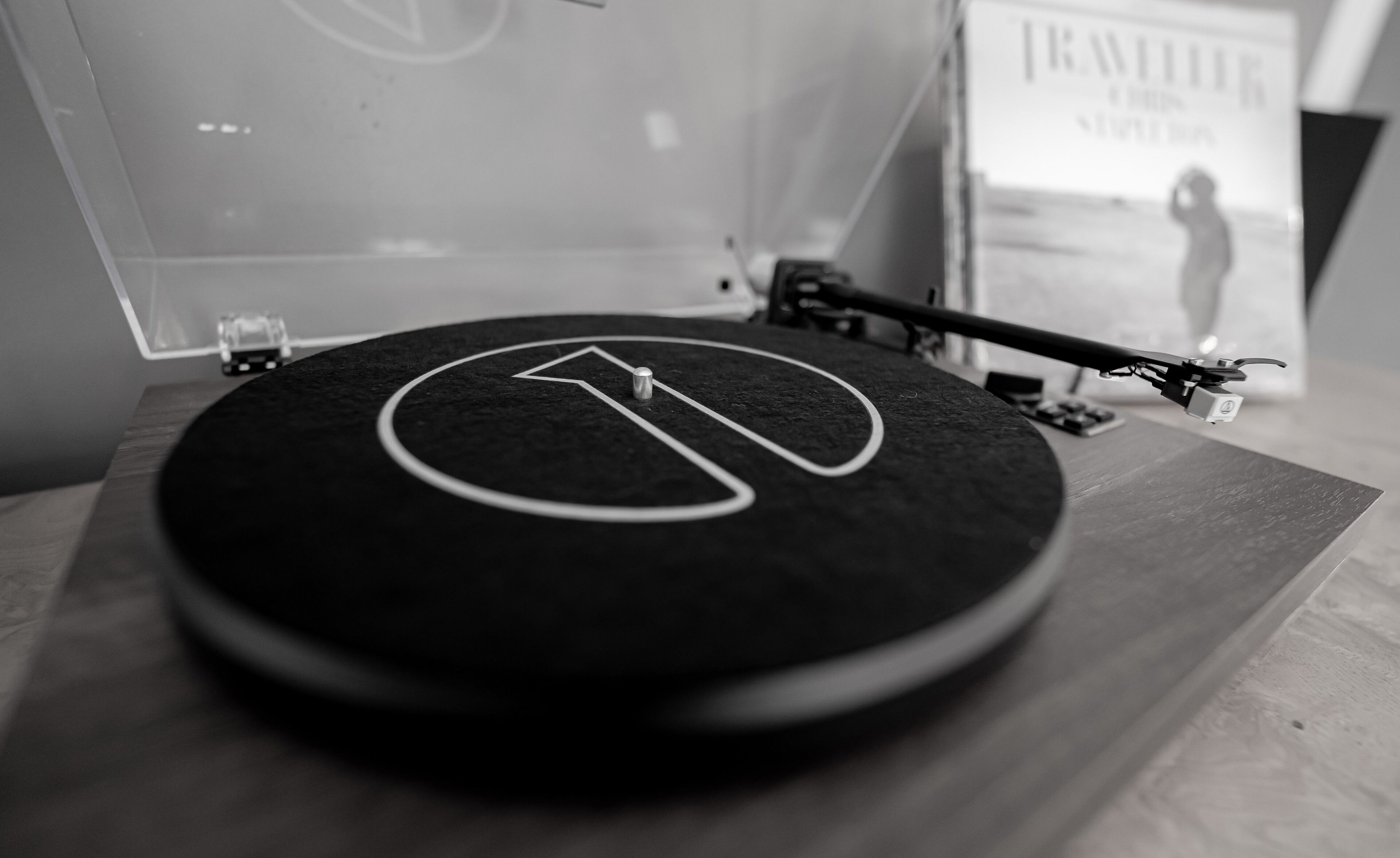 A turntable with a vinyl record on it.