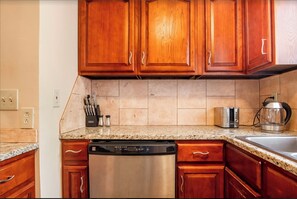 Microwave, dishwasher, coffee/tea maker, cookware/dishes/utensils