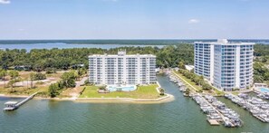 A waterfront hotel with multiple high-rise buildings, a marina, and a dock. - Best Views in Orange Beach!! (Orange Beach)