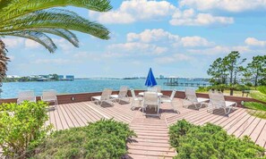 Relax on the deck surrounded by lush greenery and enjoy the serene views of the water.