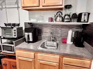 Fridge, microwave, stovetop, coffee/tea maker