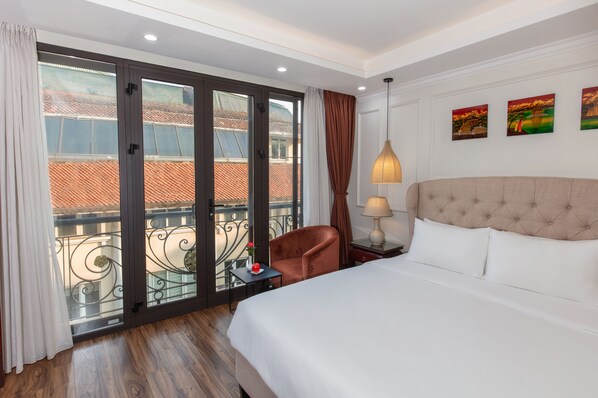 Junior Suite City View | Frigobar, Wi-Fi de cortesia, roupa de cama