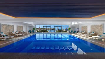 Indoor pool, seasonal outdoor pool, pool loungers, lifeguards on site