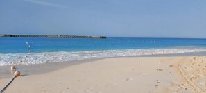Private beach, beach umbrellas, beach towels, beach volleyball