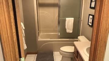 Combined shower/tub, hair dryer, towels, soap