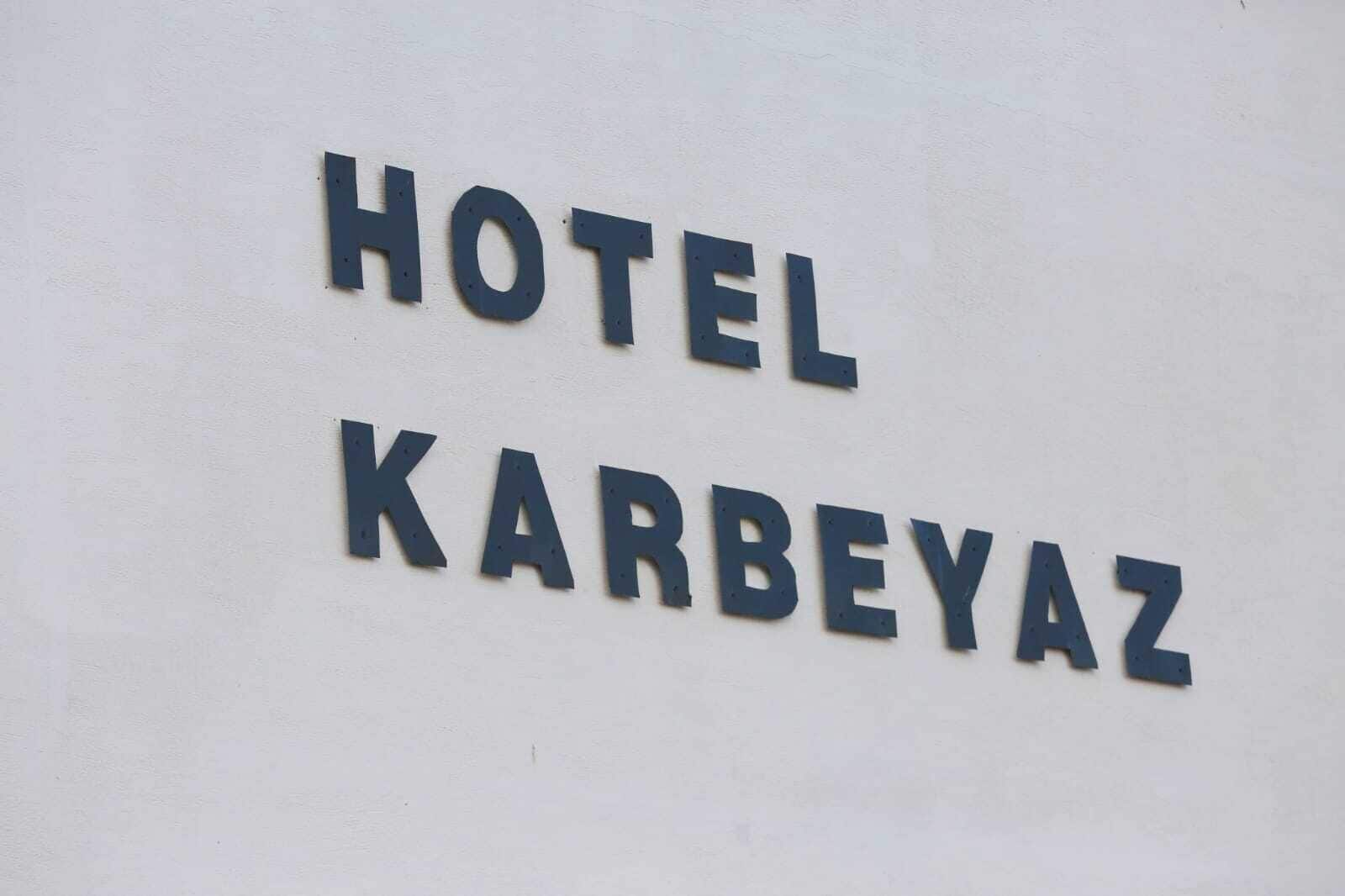 A sign with the text "HOTEL KARBEYAZ".