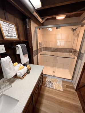 Shower, hair dryer, towels, soap
