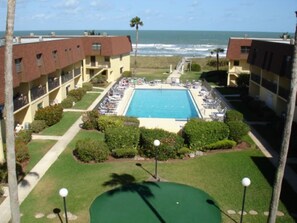 Outdoor pool, a heated pool - Ocean Front Condo (Cocoa Beach)