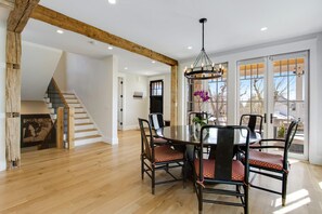 A dining area with a round table, chairs, and a chandelier. - Central Sundance location, steps to Sanitas trail and walk to downtown Boulder (Boulder)