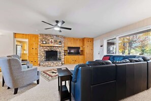 TV, fireplace, offices - Hilltop Home with Torch Lake Views (Bellaire)