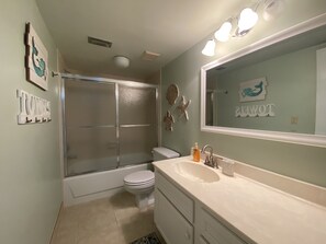 Combined shower/bathtub, hair dryer, towels, soap