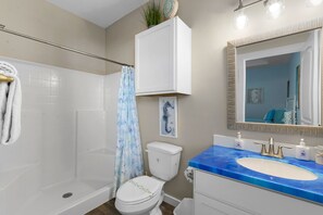 Shower, hair dryer, towels, soap