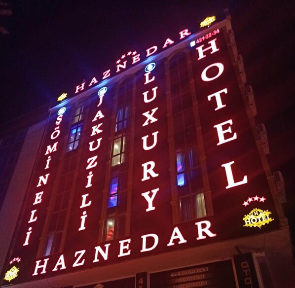 A hotel with illuminated signage spelling out its name, "HAZNEDAR HOTEL." - Haznedar Luxury Residence Hotel (Istanbul)