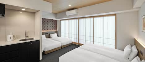 Apartamento família, para não fumantes (4 Single Beds) | 1 quarto, edredons de pluma, cofres nos quartos
