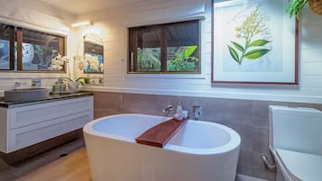 Bathtub, hair dryer, towels, soap