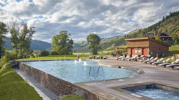 Seasonal outdoor pool, open 8:00 AM to 9:00 PM, pool umbrellas