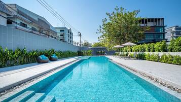 Outdoor pool, open 7:00 AM to 10:00 PM, pool umbrellas, pool loungers
