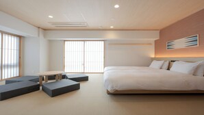 A modern hotel room with a large bed, a small table, and a sofa. - MIMARU Osaka Namba Station (Osaka)