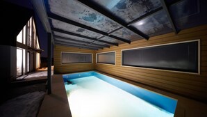 A modern indoor swimming pool with wooden paneling and large windows. - Radvanice Kcg351 in Radvanice (Radvanice)