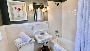 Combined shower/tub, hair dryer, towels, soap