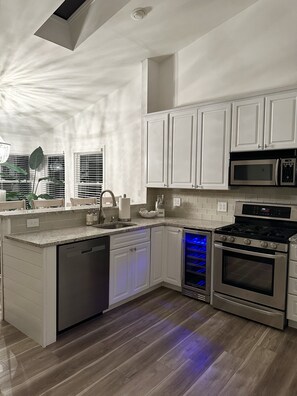 Enjoy cooking in this well-equipped kitchen with a dishwasher, double oven, and microwave.