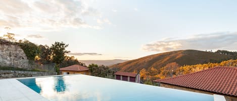 Seasonal outdoor pool, open 8:30 AM to 8:30 PM, pool umbrellas