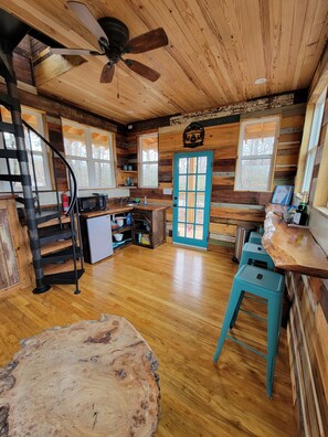 Fridge, microwave, coffee/tea maker, cookware/dishes/utensils