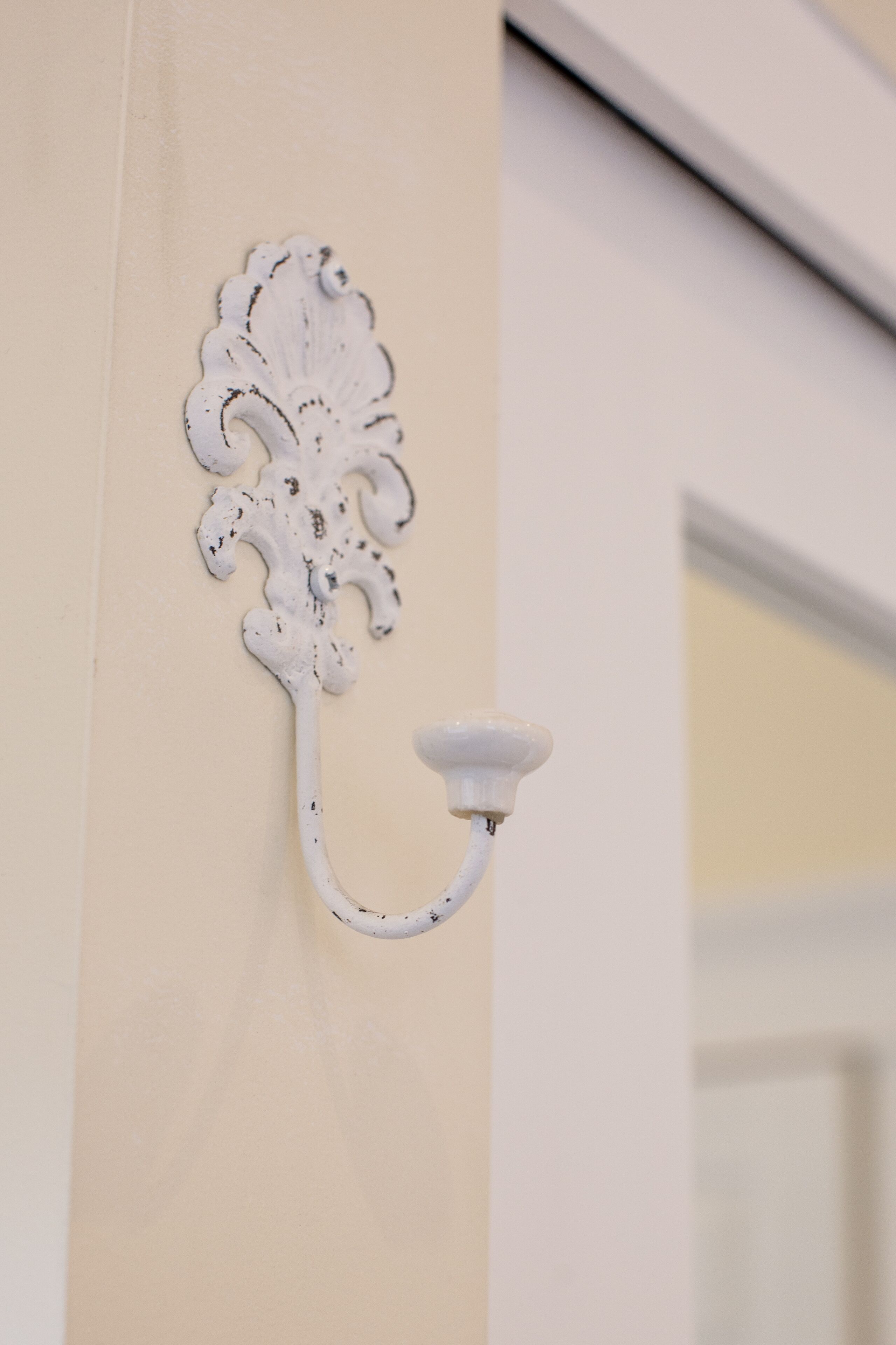 A wall-mounted light fixture with an ornate design.