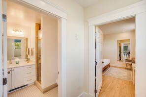 Shower, hair dryer, slippers, towels