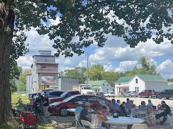 Picture of the house in the background. 