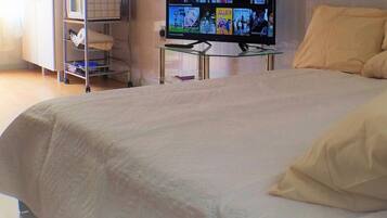 1 bedroom, desk, iron/ironing board, travel crib