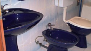 A bathroom with a sink, toilet, and bidet. - Remarkable 2-bed Apartment in Tribunj, Best View (Tribunj)